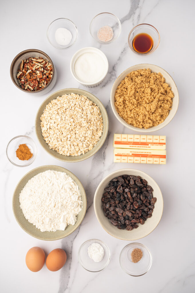 Ingredients for Brown Butter Oatmeal Raisin Cookies laid out on a table.