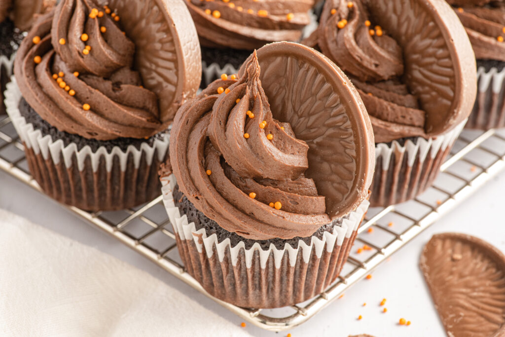 Chocolate Orange Cupcakes on a metal cooling rack.