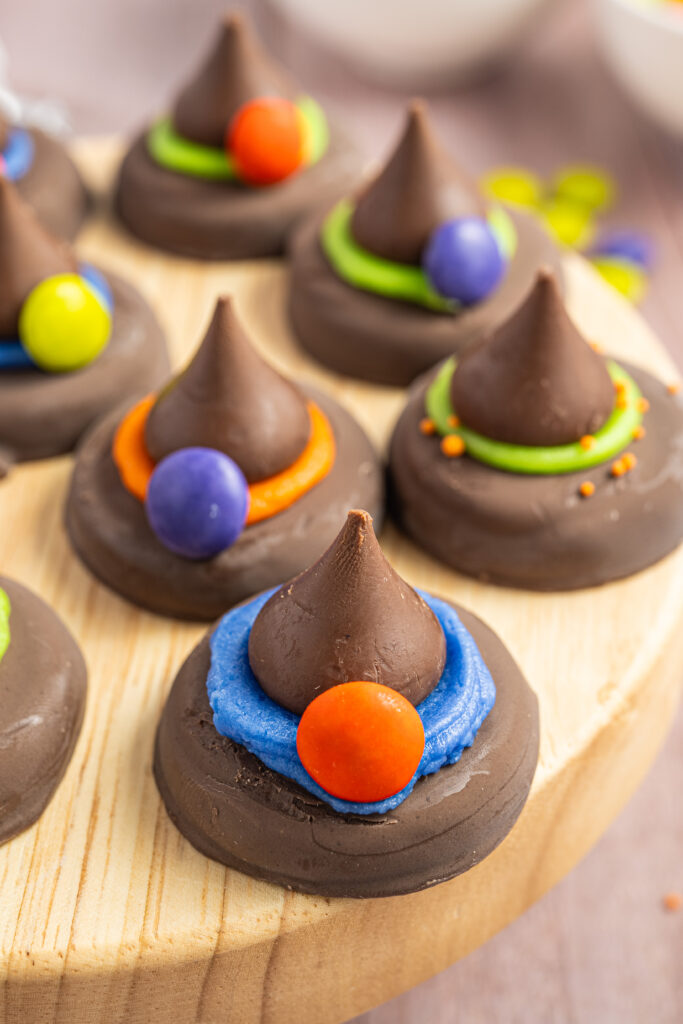 Peanut Butter Witch Hat Cookies on a small wood display.