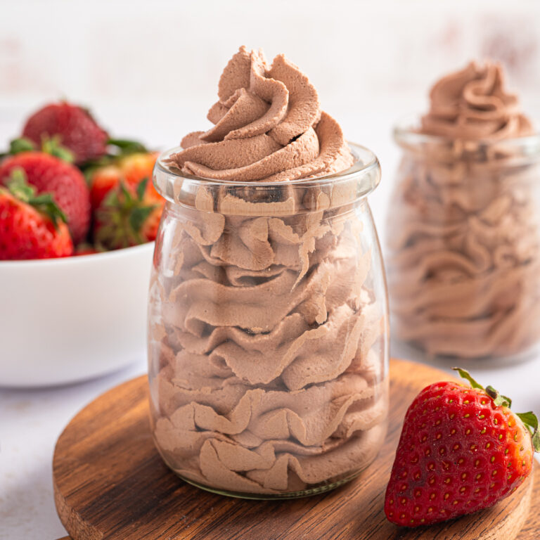 Chocolate Whipped Cream piped into a small jar.