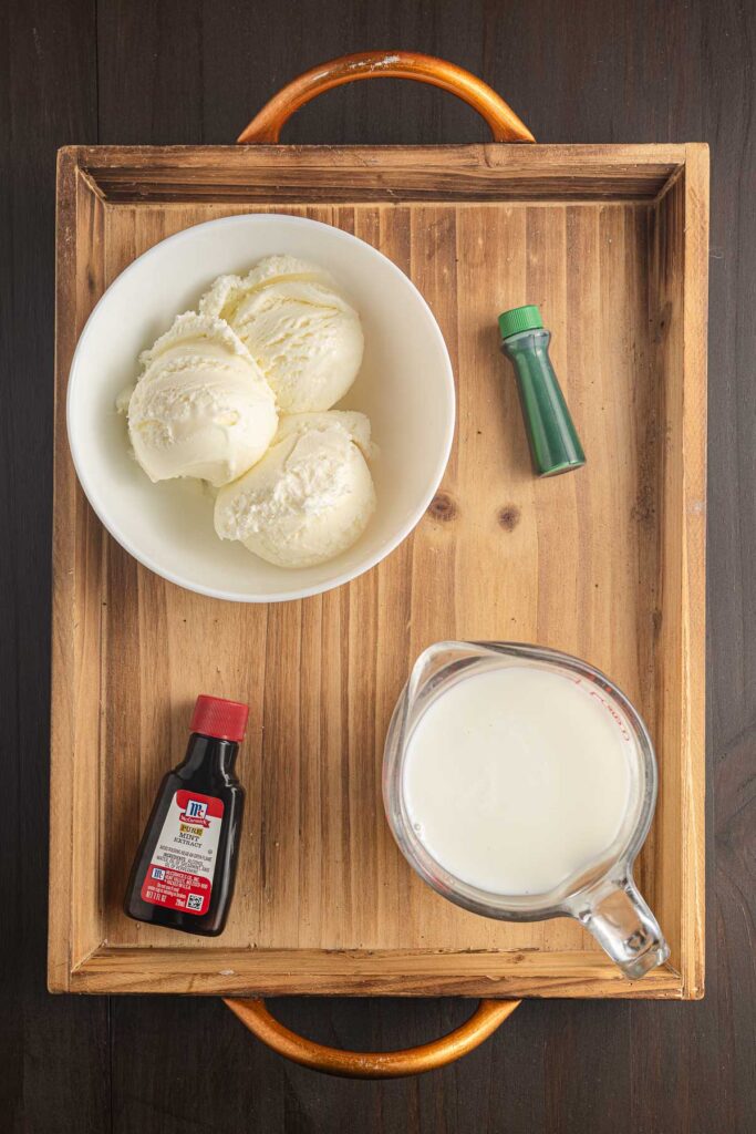 Ingredients for shamrock shake on a table.
