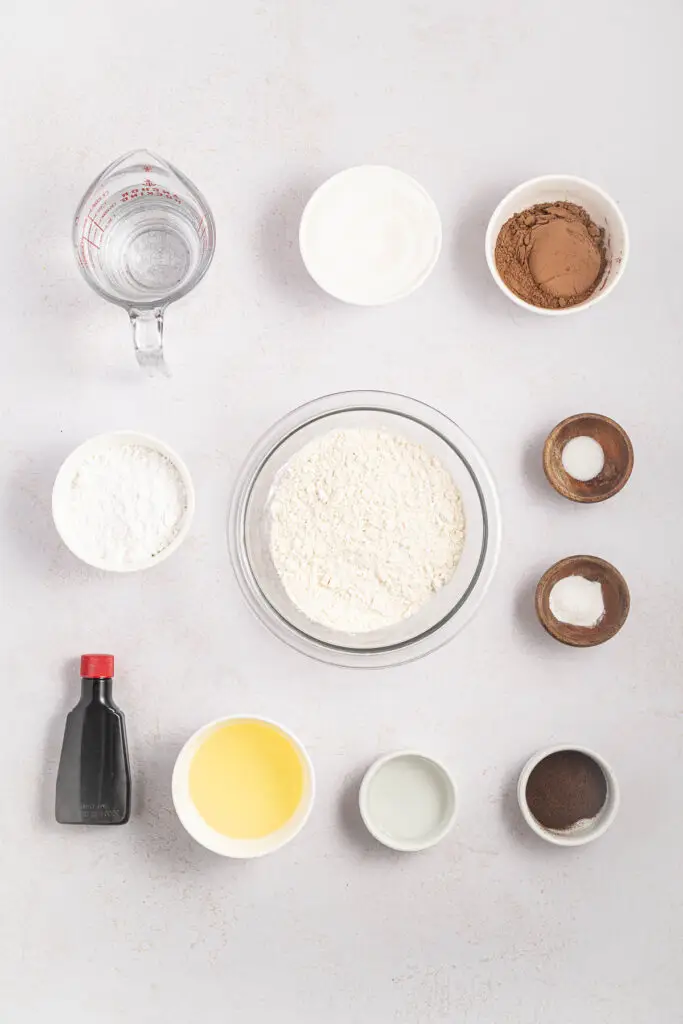 Ingredients for wacky cake laid out on a table.