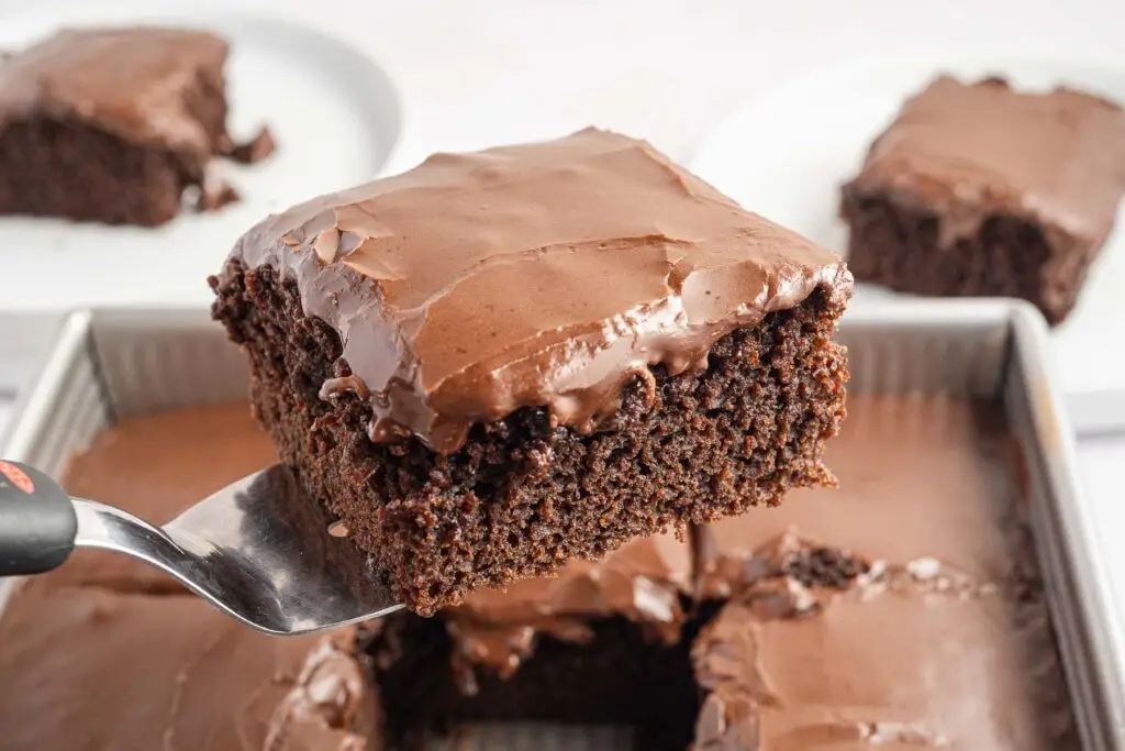 A slice of wacky cake on a spatula.