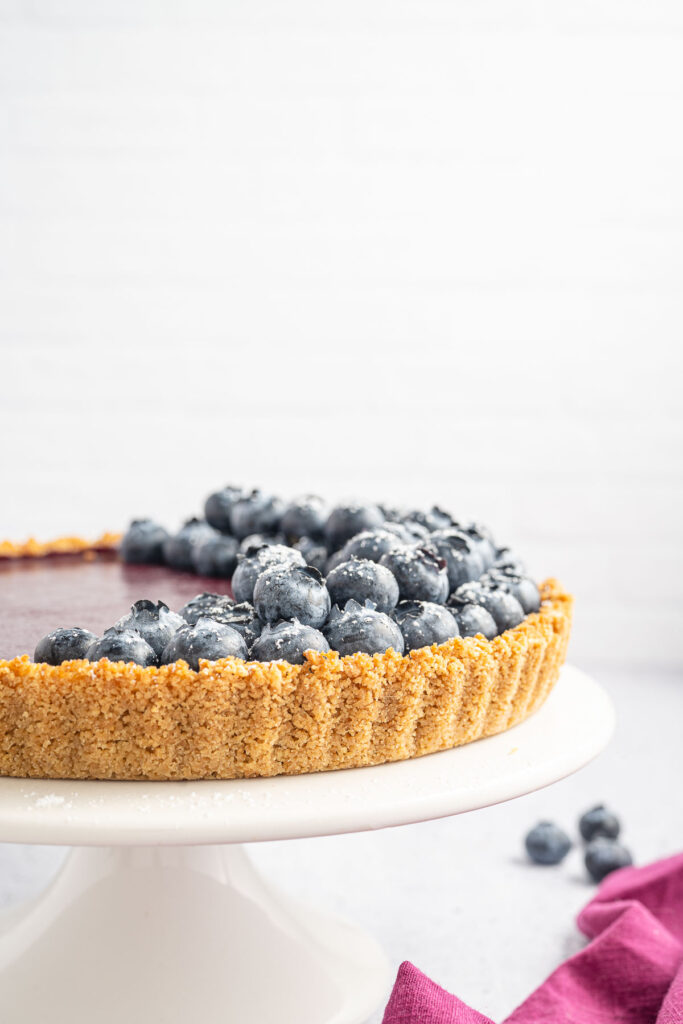 Blueberry curd tart with fresh blueberries on top